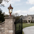 Stone pillar lights installed at the entrance of a luxurious estate, providing classic and elegant illumination.