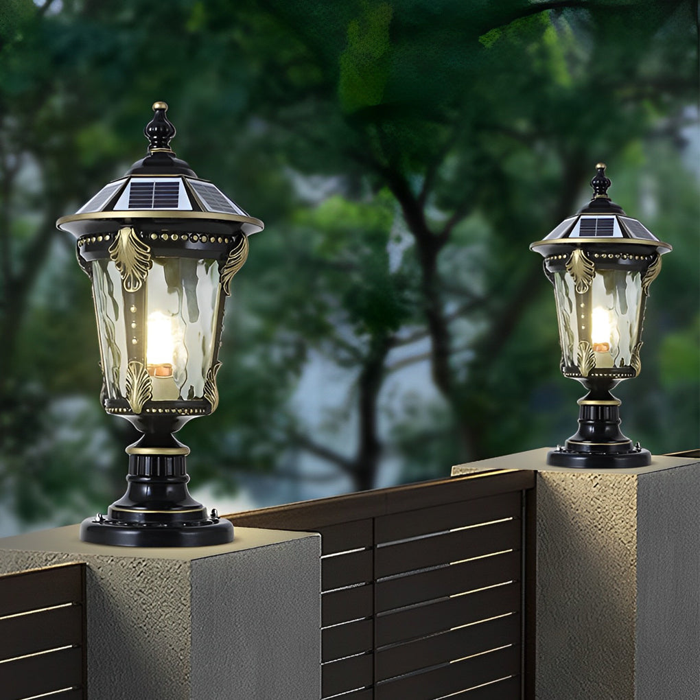Stone pillar lights beside a wooden door, adding a vintage charm to the outdoor space.