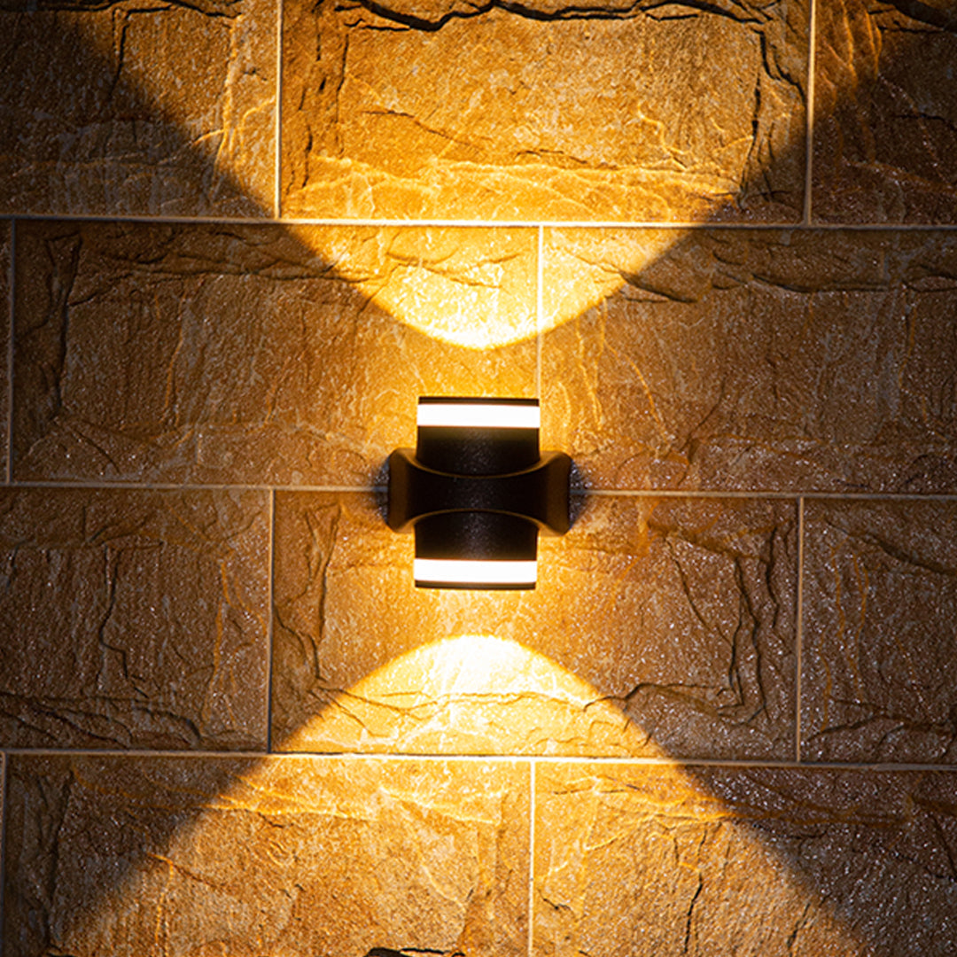 Modern black curved outdoor wall light with integrated LED and sleek geometric design