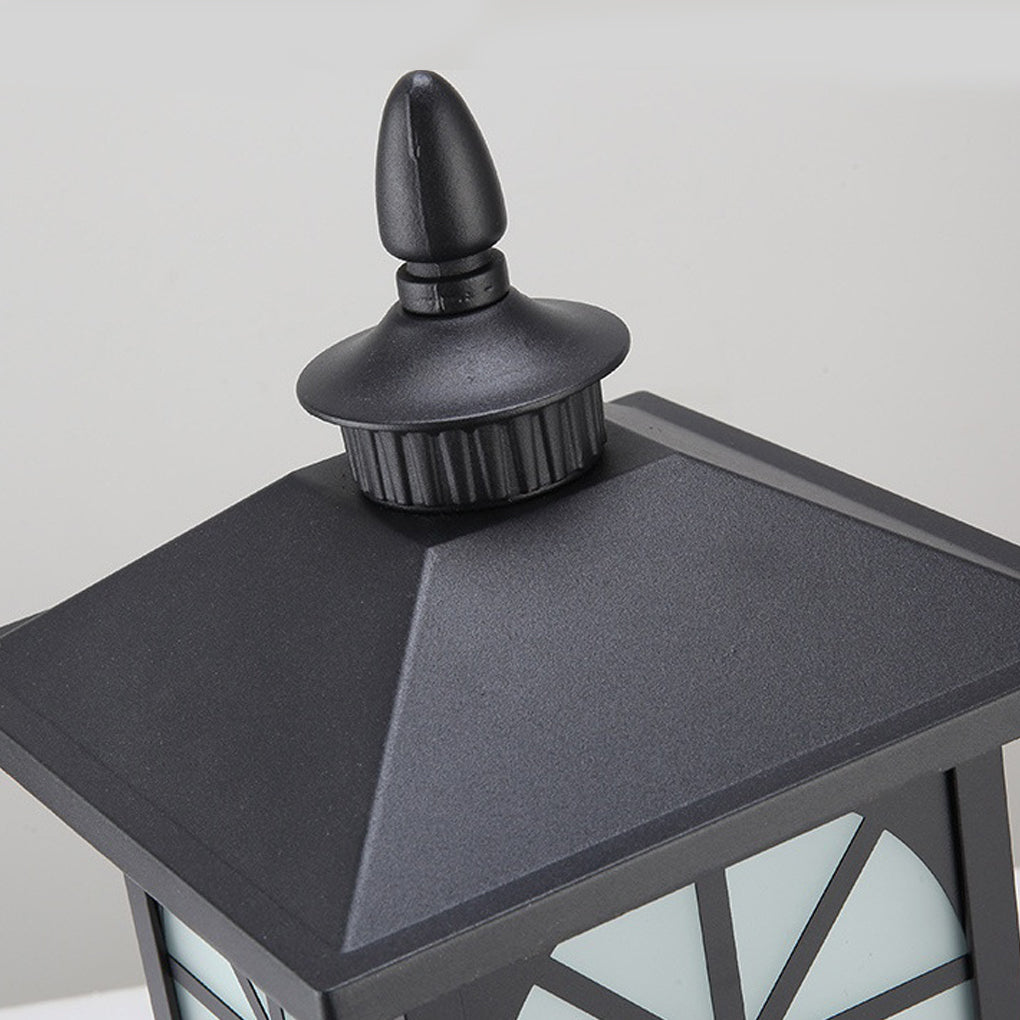 Top cap detail of outdoor street light pillar with textured metal finish.