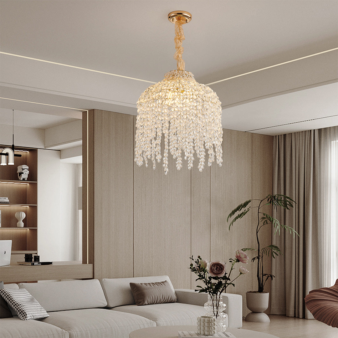 Luxurious living room with teardrop crystal chandelier, enhancing the cozy and refined atmosphere.