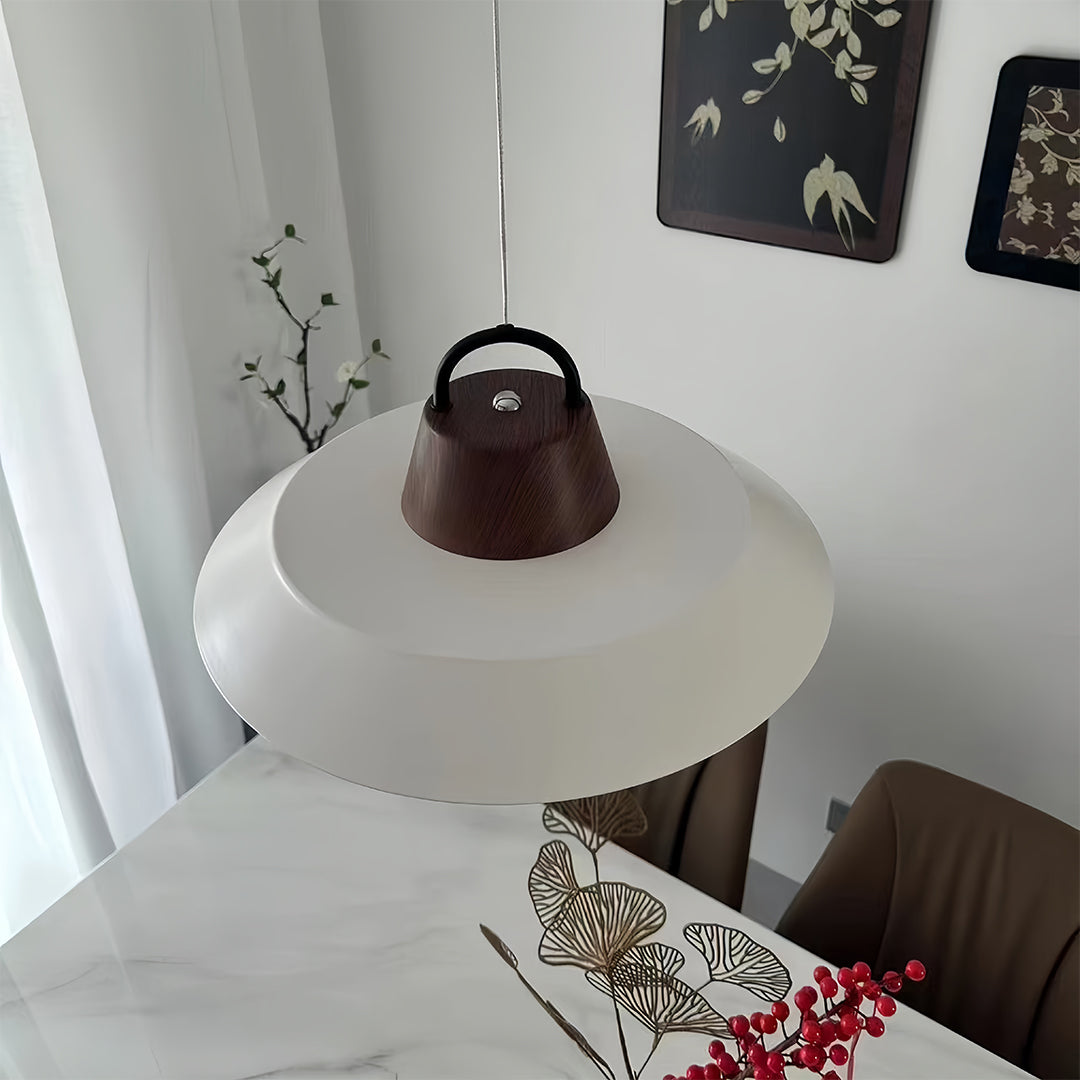 Stylish single pendant lights for kitchen installed above dining area creating focused task lighting