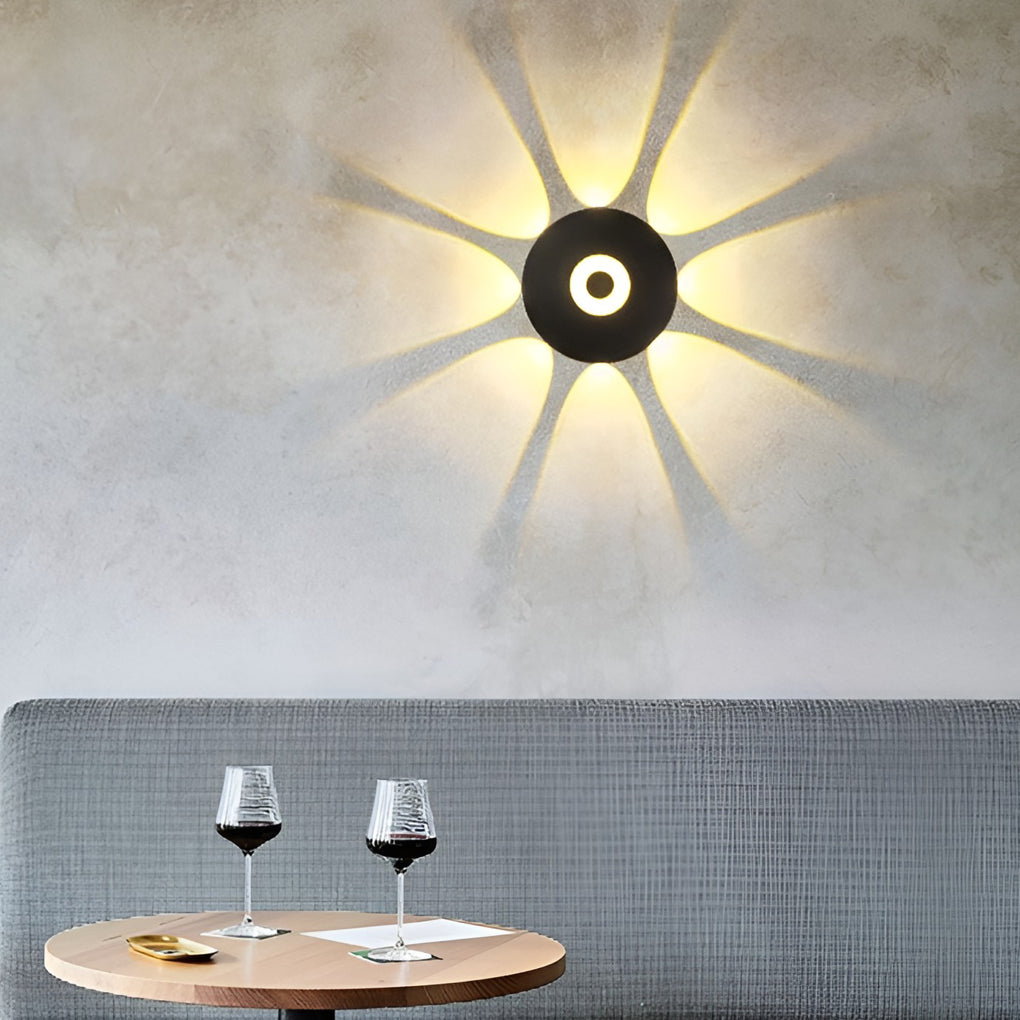 Sunflower LED wall light with a close-up of the starburst light effect.