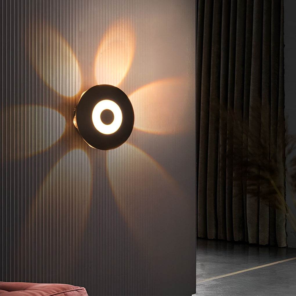 Sunflower LED wall light illuminating a minimalist indoor wall with soft light.