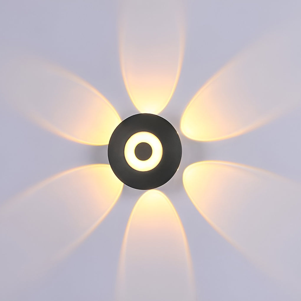 Sunflower LED wall light enhancing a modern outdoor patio with warm glow.