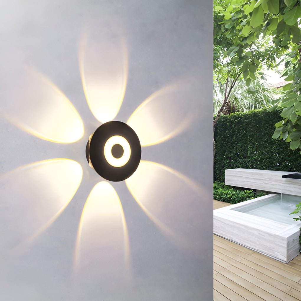 Sunflower LED wall light providing warm light in a cozy living room setting.