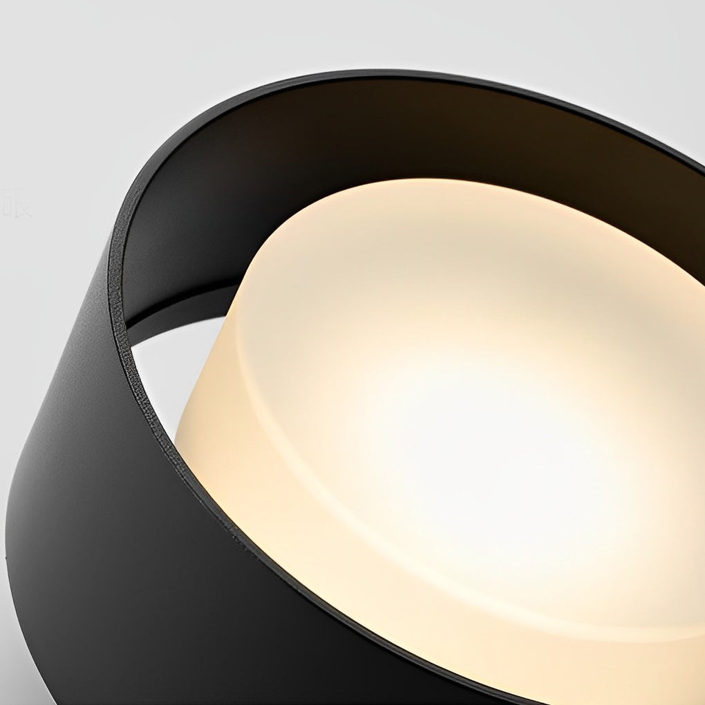 Surface mounted LED downlight with a black finish, displayed from an angled perspective.