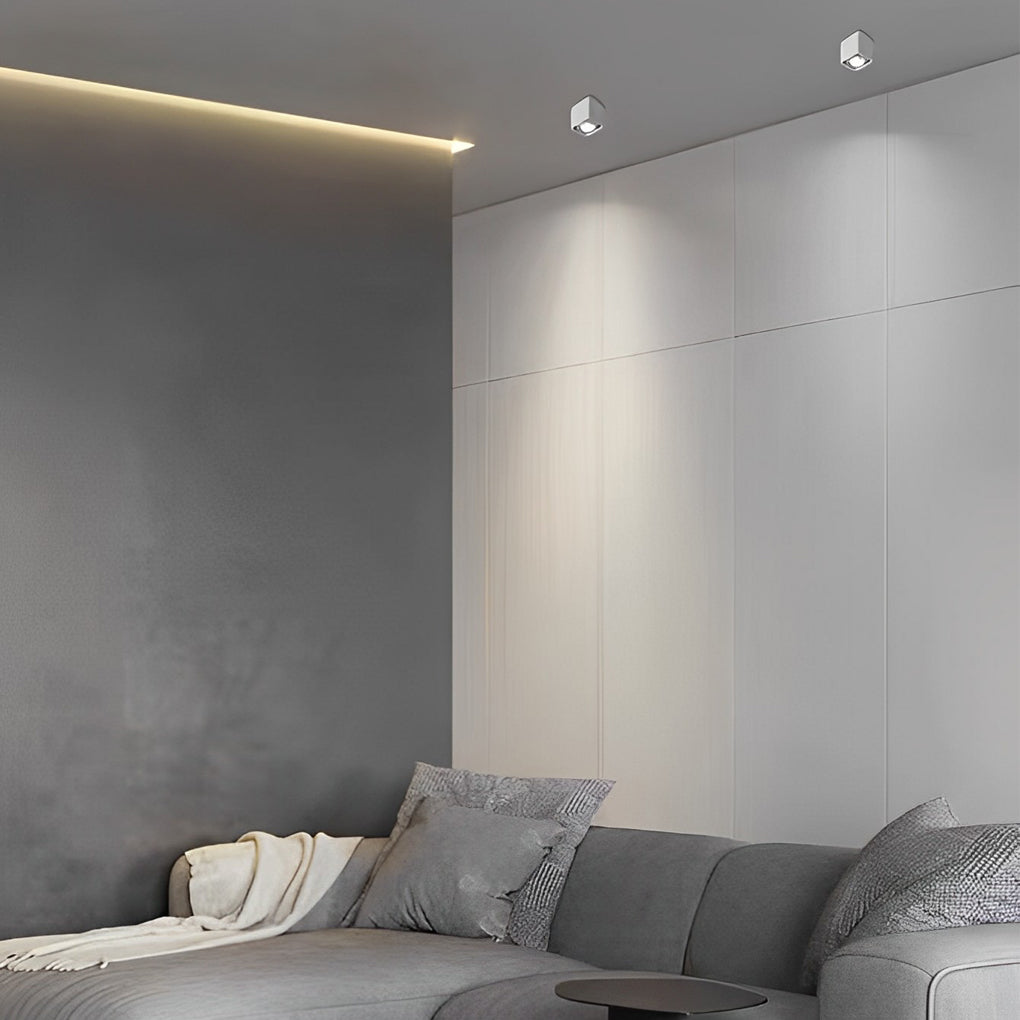 Surface mounted spot light illuminating bedroom with warm glow.
