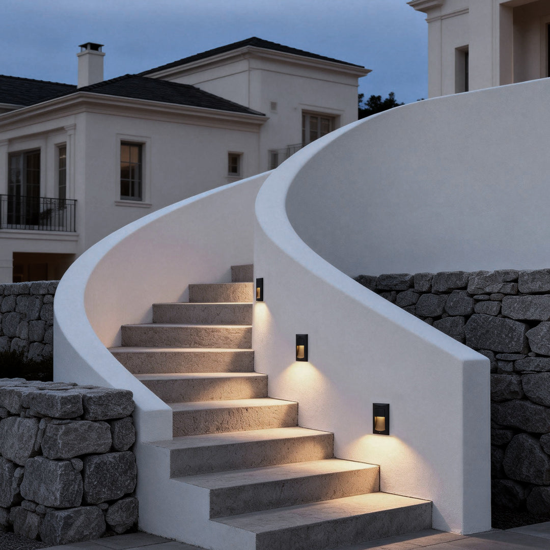Surface mounted step lights enhancing a curved staircase with modern lighting.