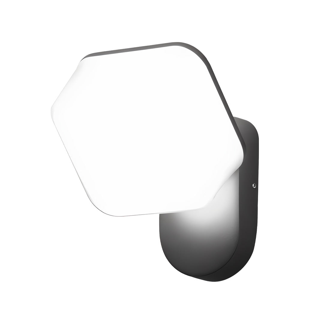White hexagon swing wall light casting warm ambient light on exterior walls in a residential outdoor scene.