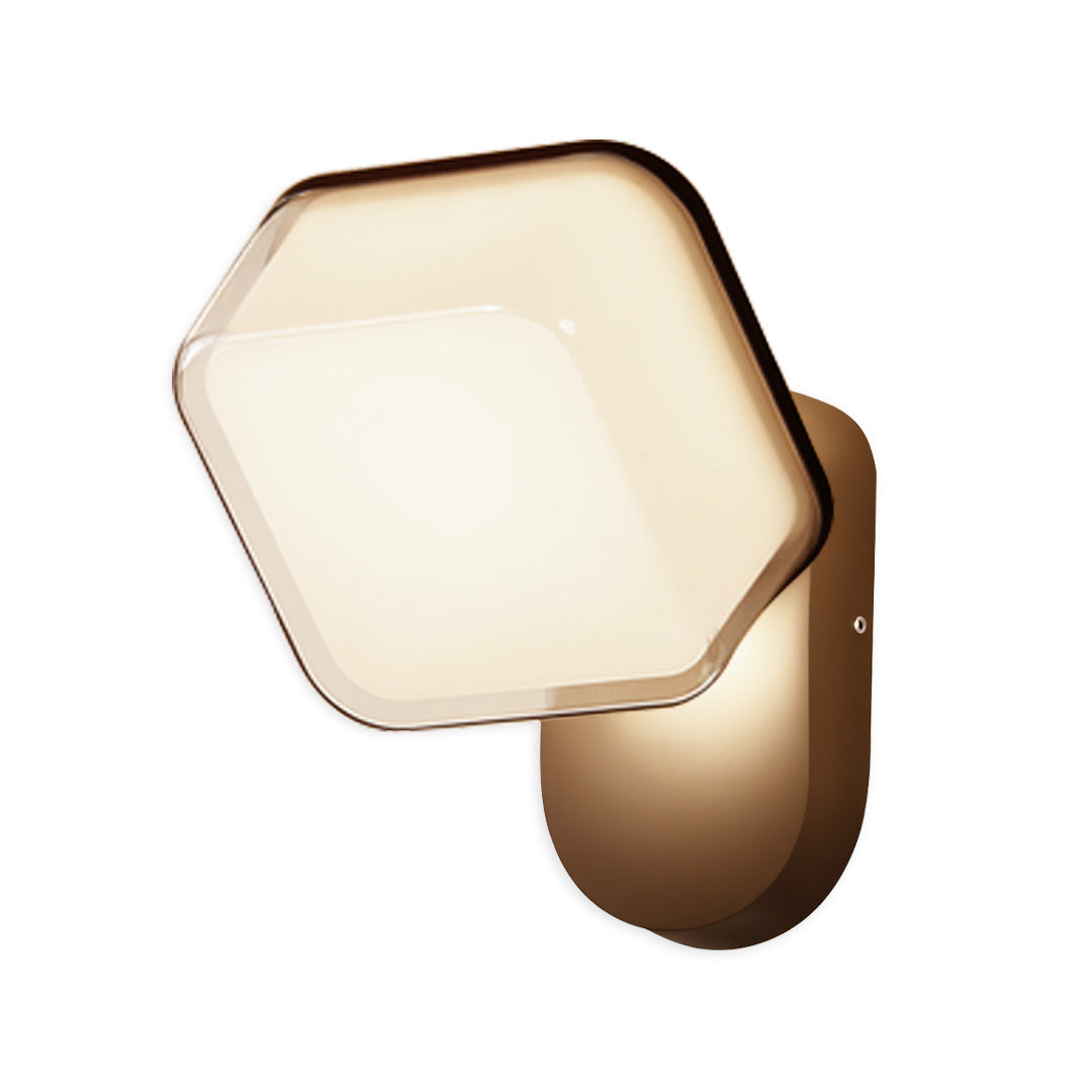 Minimalist hexagon swing wall light with warm illumination and bronze backing for cozy wall lighting.