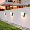 White hexagon swing wall light with bronze accent edge, offering warm decorative wall lighting.