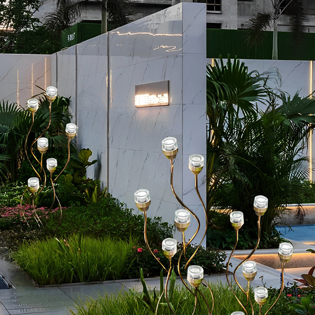 Syphasera standing lamp arranged in a contemporary courtyard garden with lush greenery.