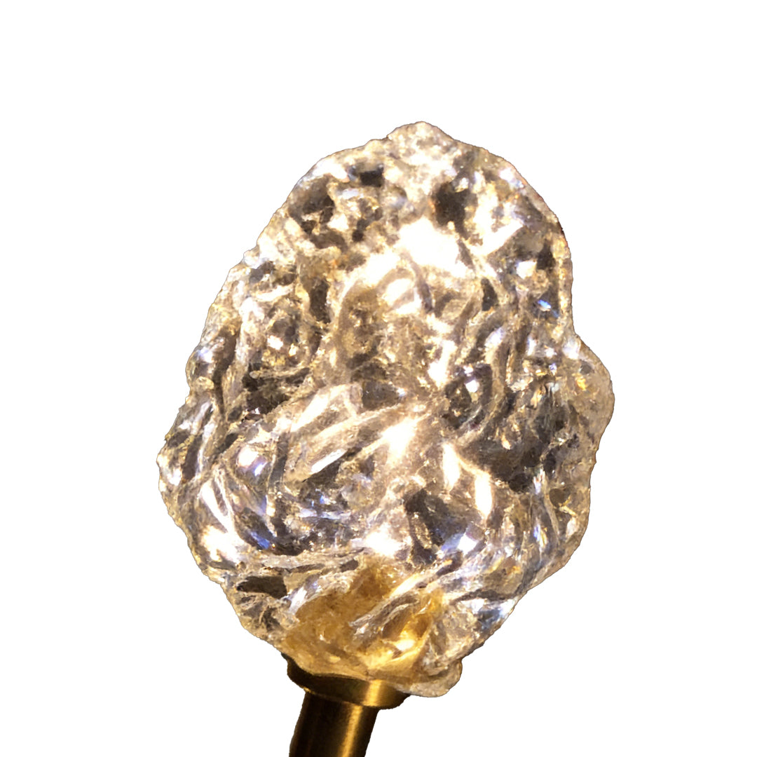 Syphasera standing lamp close-up showing textured crystal-like light head detail.