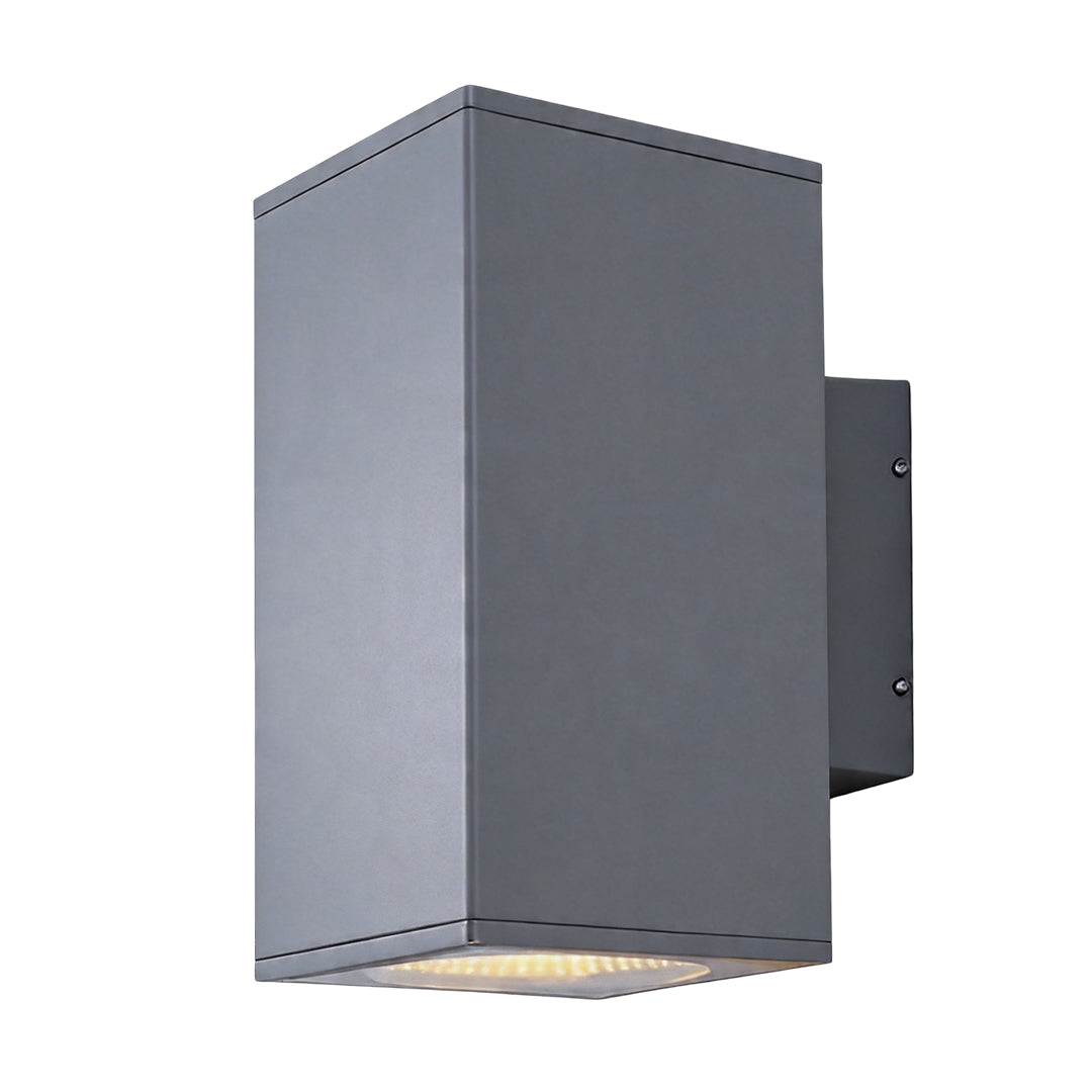 Tall grey wall sconce up and down light fixture with a glowing bulb isolated on white backgrounds
