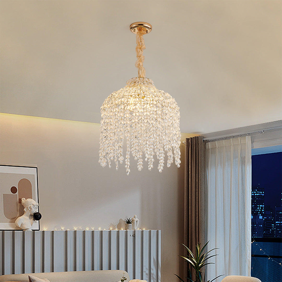 Modern nursery decorated with a stunning gold teardrop crystal chandelier, adding gentle sparkle.
