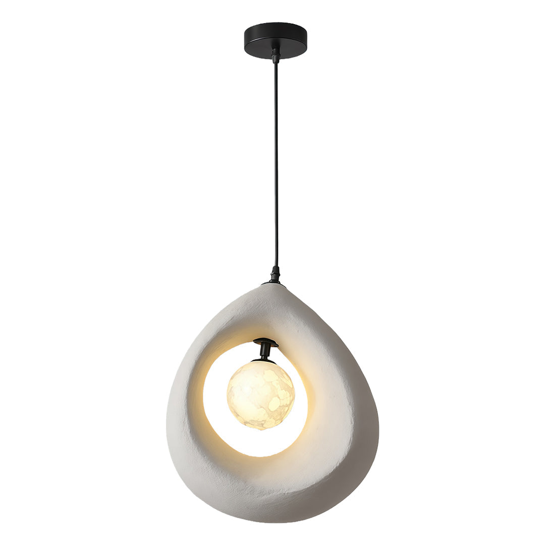 Textured statement pendant light with artistic hollow form and soft diffused inner light.
