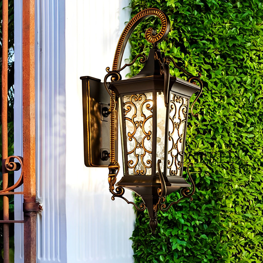 Traditional antique outdoor wall sconce with downward-facing lantern design and ornamental metal accents.