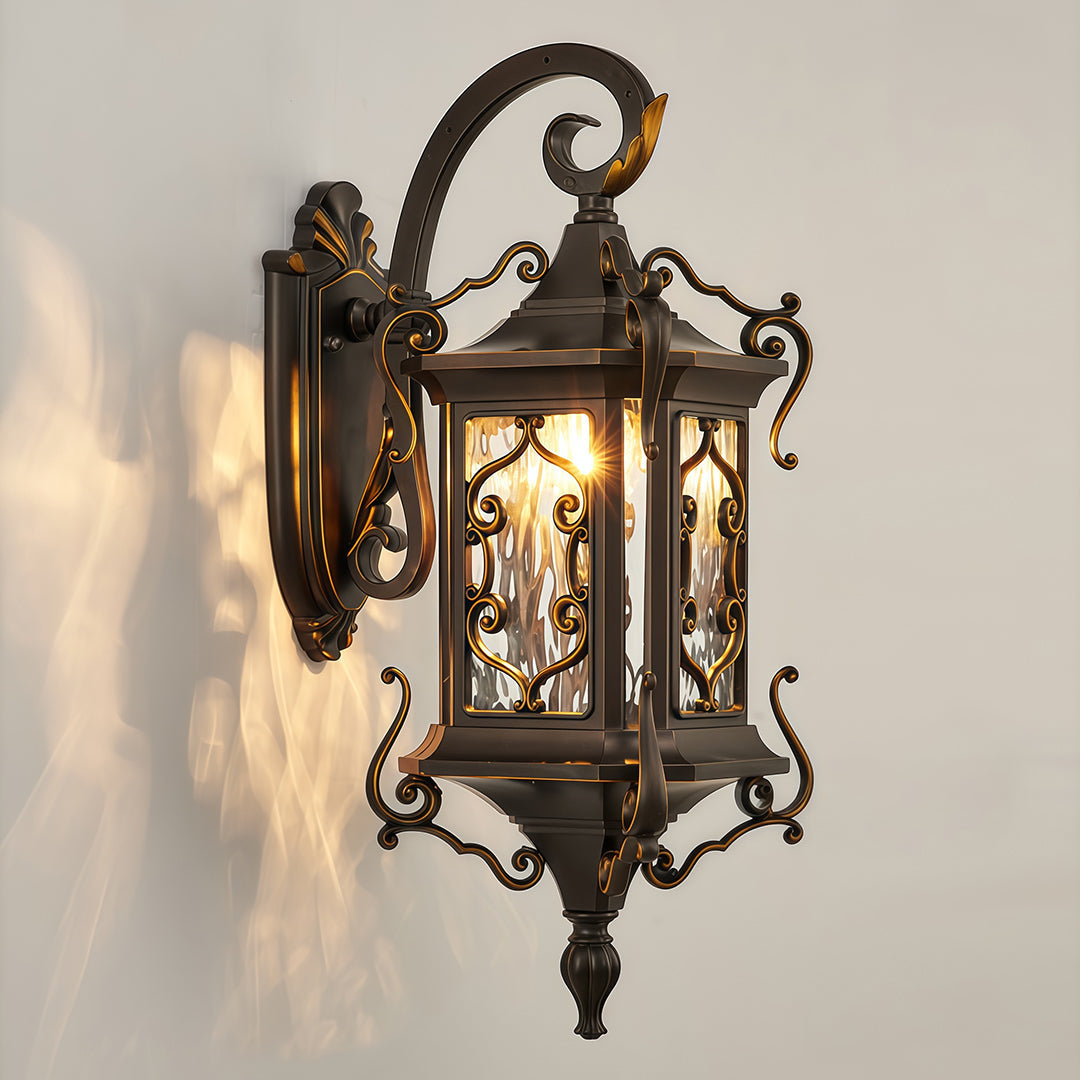 Traditional outdoor wall sconce lights with ornate metal frame and warm lighting effect.
