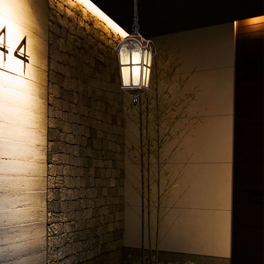 Traditional hanging pendant light with amber glow in rustic stone interior