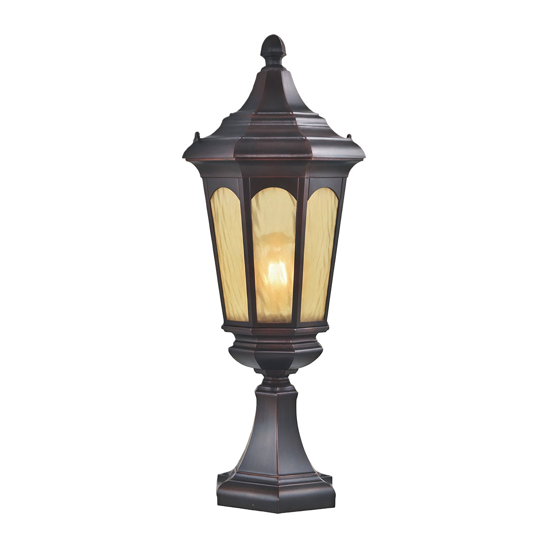 Traditional residential pillar light featuring ornate lantern design with warm glass in dark metal finish
