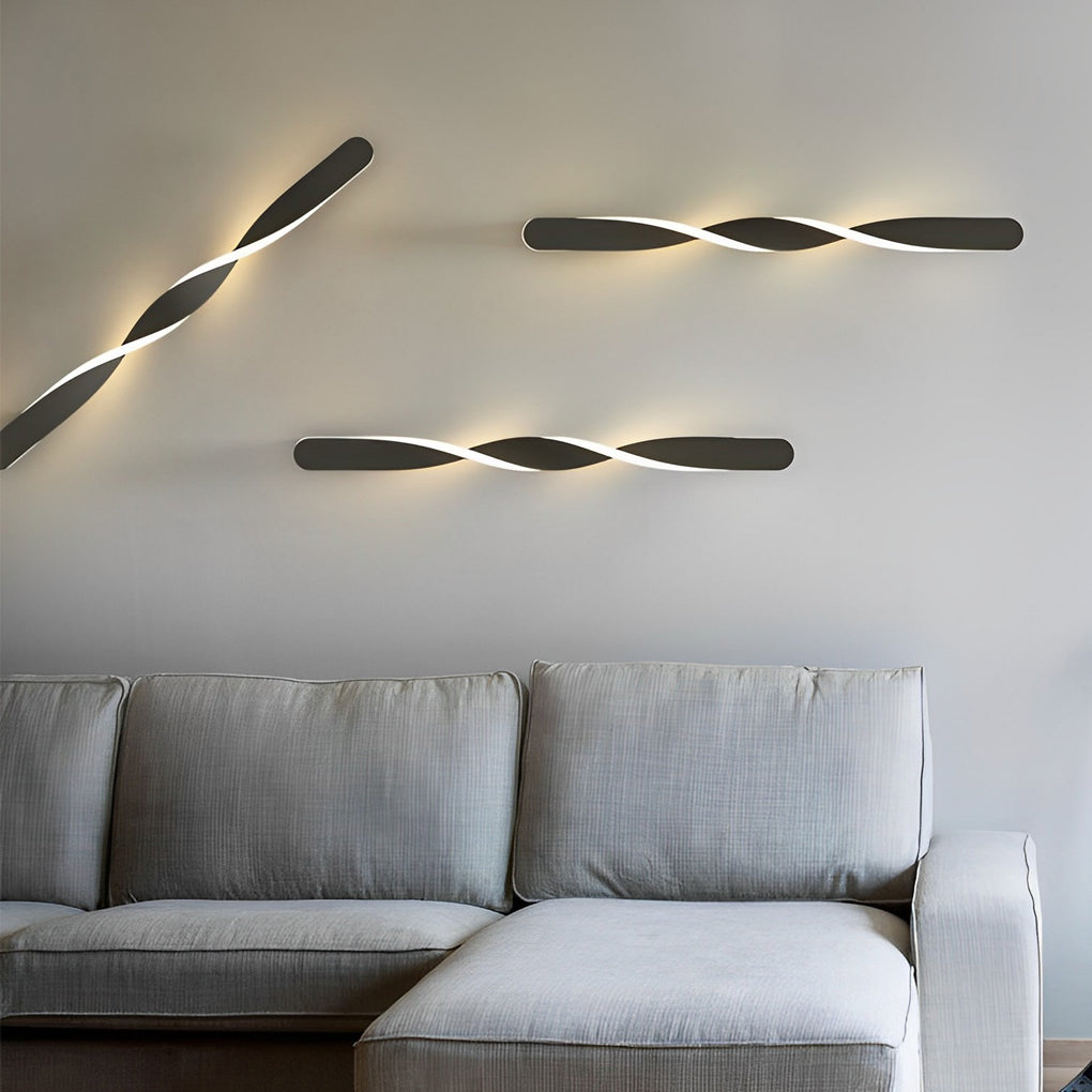Twisted LED wall lights providing soft illumination in a cozy living room.
