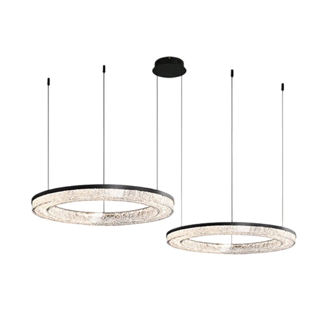 Two circle pendant light with a metallic frame, providing sophisticated lighting in a minimalist living room.