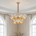 Luxurious two-tiered modern large chandeliers featuring textured glass leaf elements and a gold finish in an elegant room.