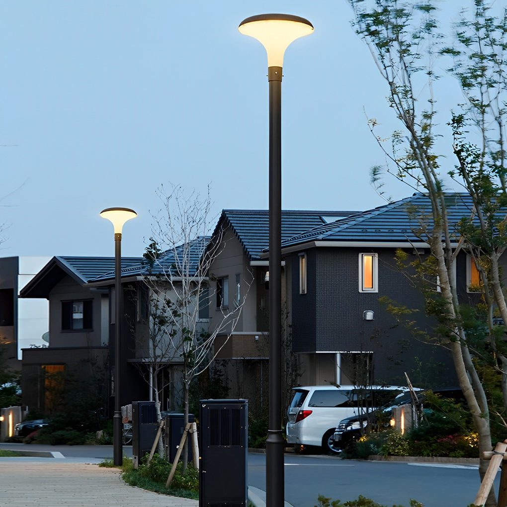 UFO solar street lights installed along a residential street at dusk.