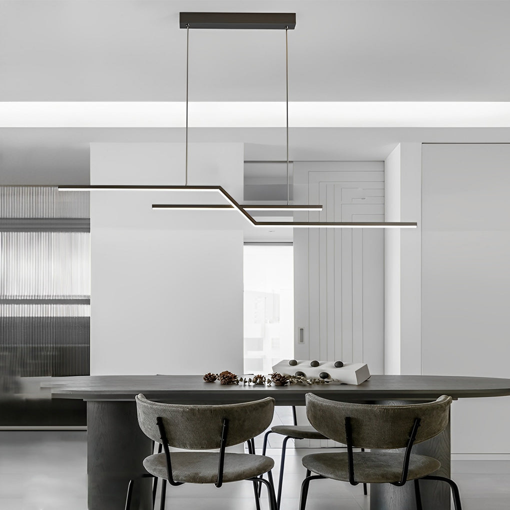 Unique pendant lighting in a minimalist living and dining area, blending linear geometry with clean architectural lines.