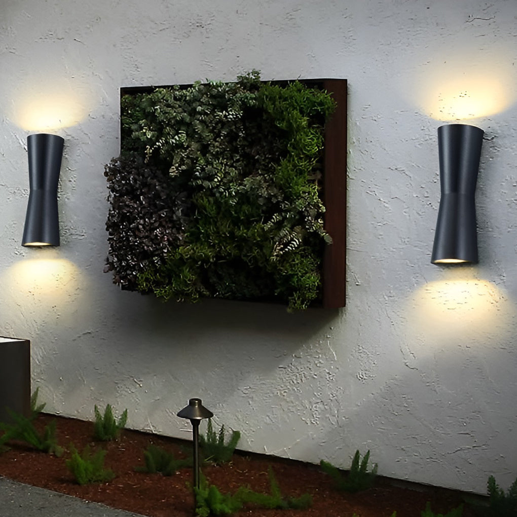 Up and down exterior wall light used in a modern outdoor corridor for pathway illumination.