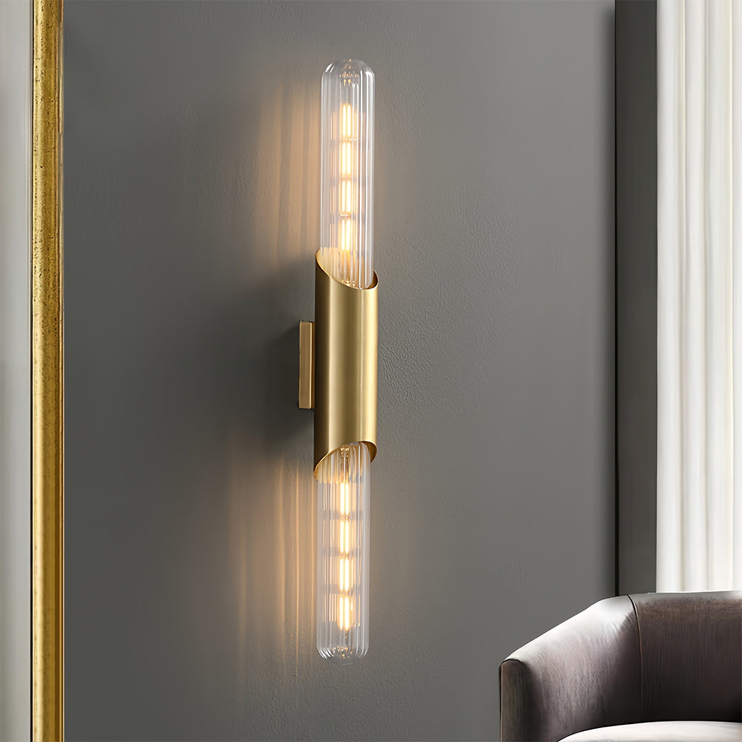 Up down wall lights with clear glass shades, adding a stylish touch to a cozy living room corner.