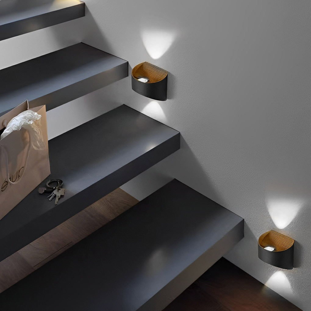 Up and down wall sconce lighting in a cozy reading nook, offering warm and inviting light.