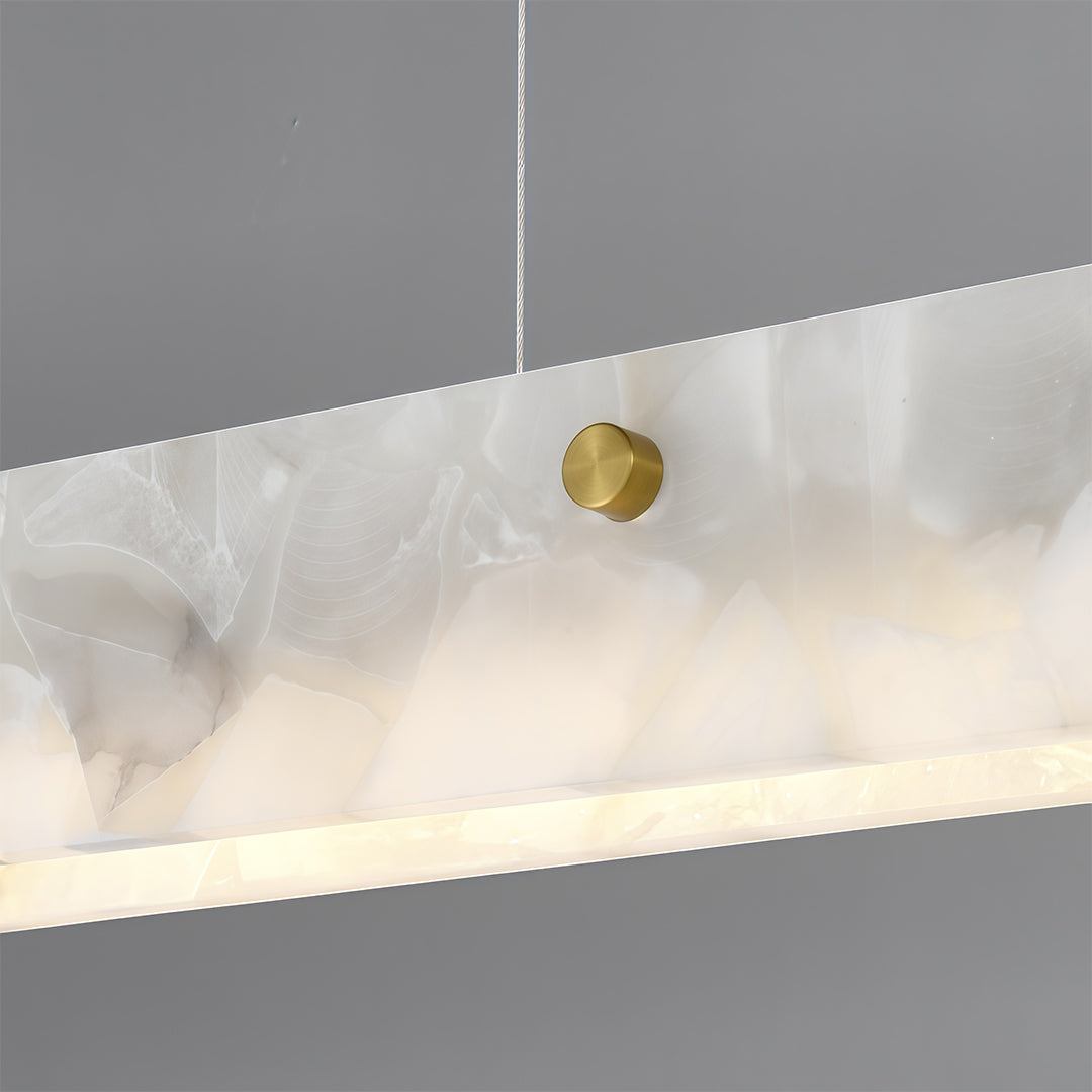 Upgrade your lighting with the copper metal pendant light and its elegant linear alabaster shade, perfect for creating a warm and stylish atmosphere.