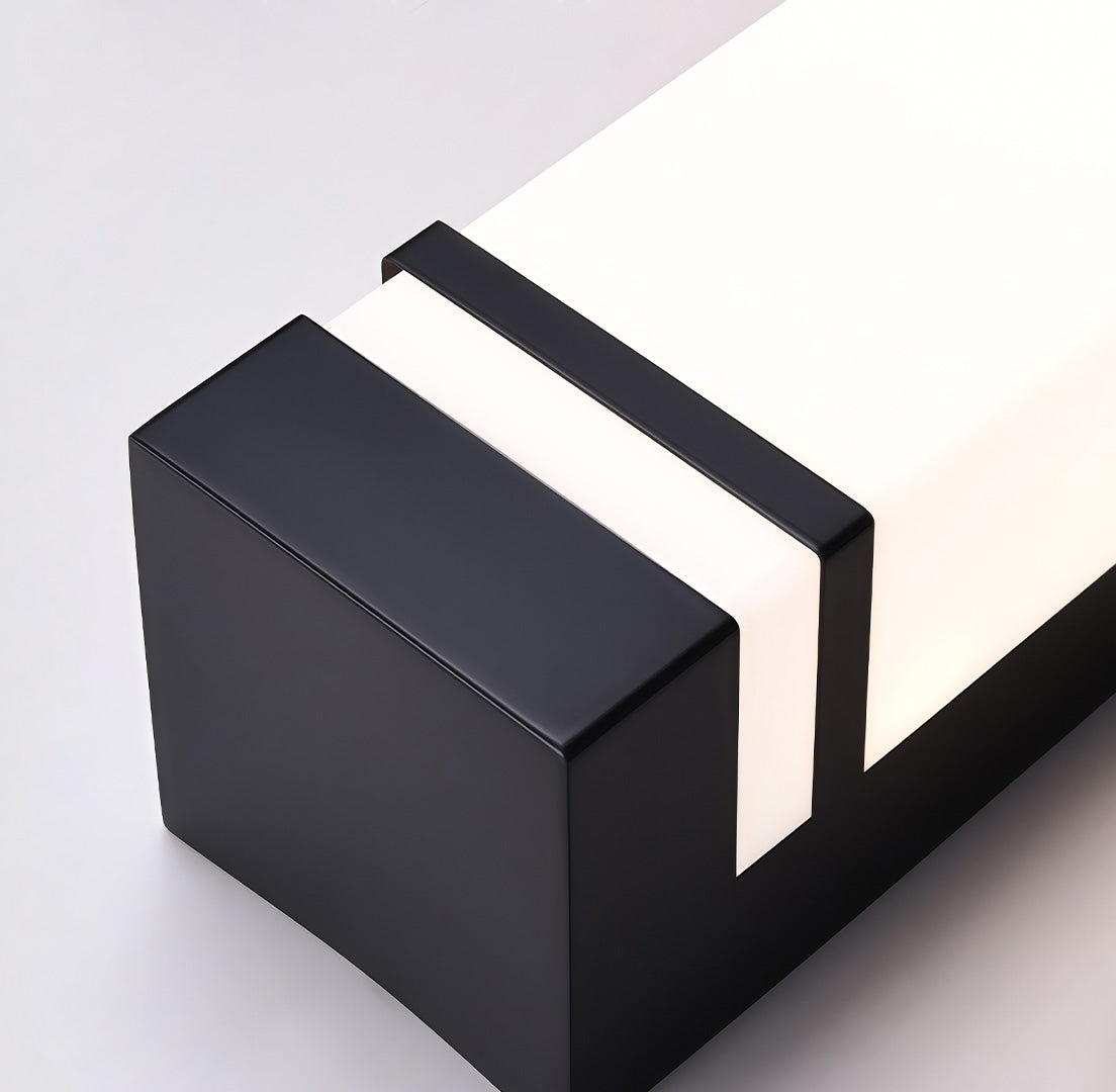 Vertical wall lighting fixture displayed from the side, emphasizing its depth and elegant design.