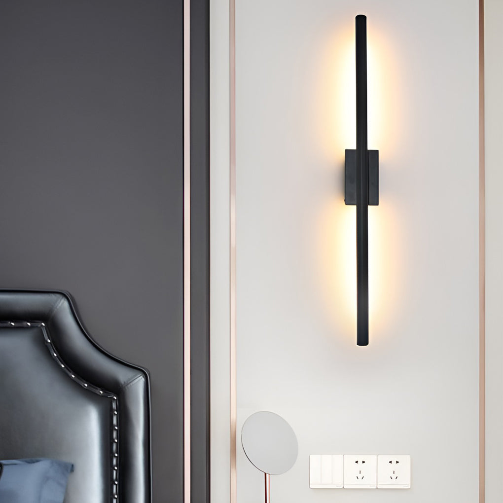 Vertical wall lights enhancing a modern sofa area with warm light.