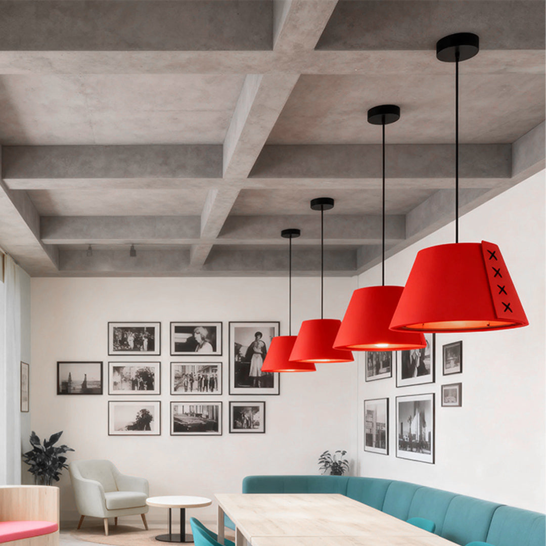 row of vibrant red felt hanging pendant lights creating a statement in a minimalist cafe