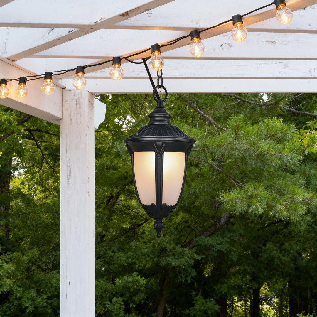 Vintage-style outdoor porch pendant light under a pergola, warm and inviting exterior lighting