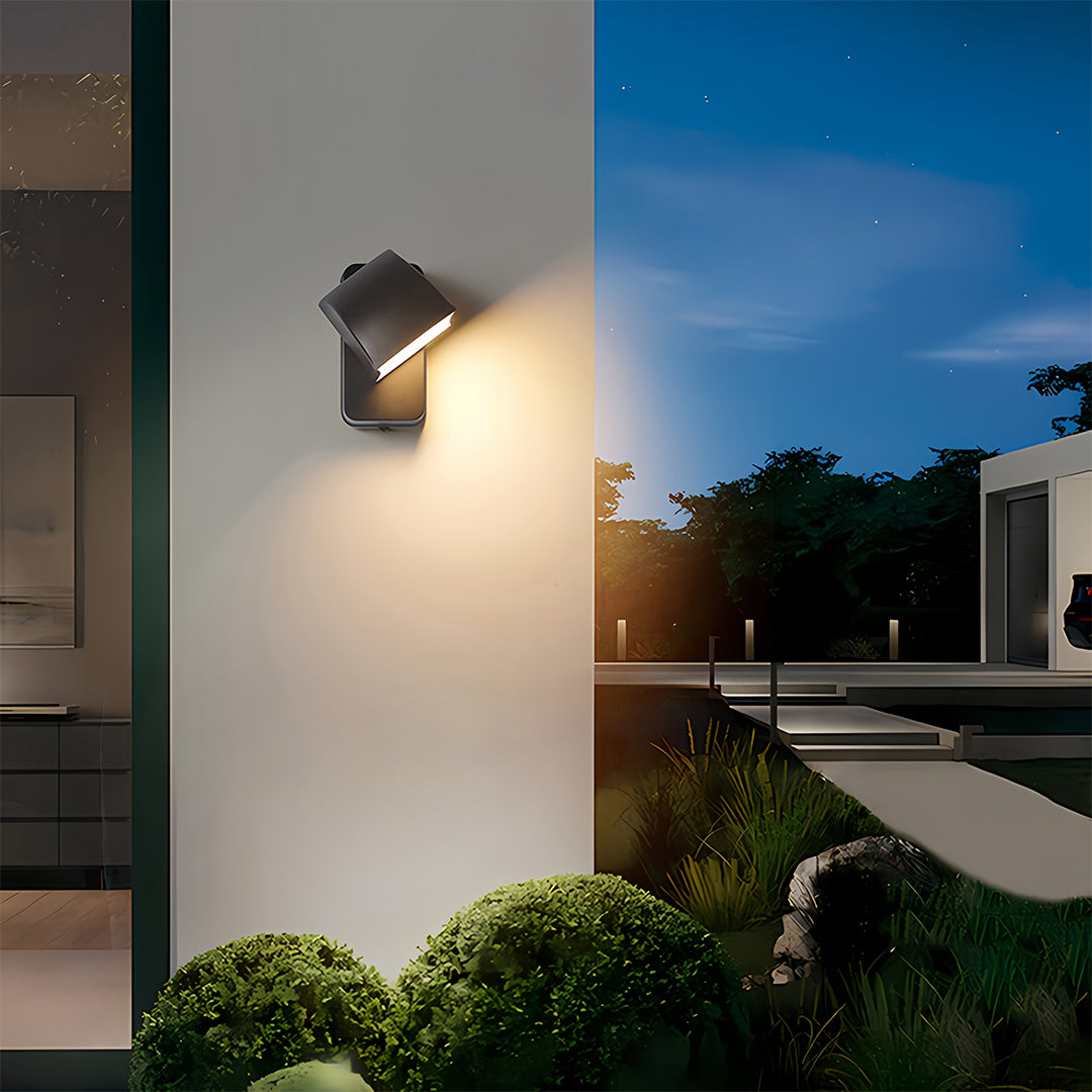Wall industrial lights flanking modern entrance illuminating contemporary home facade at twilight