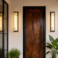 Wall mounted exterior lights with geometric black frame provide stylish outdoor illumination for porches, patios, and pathways.