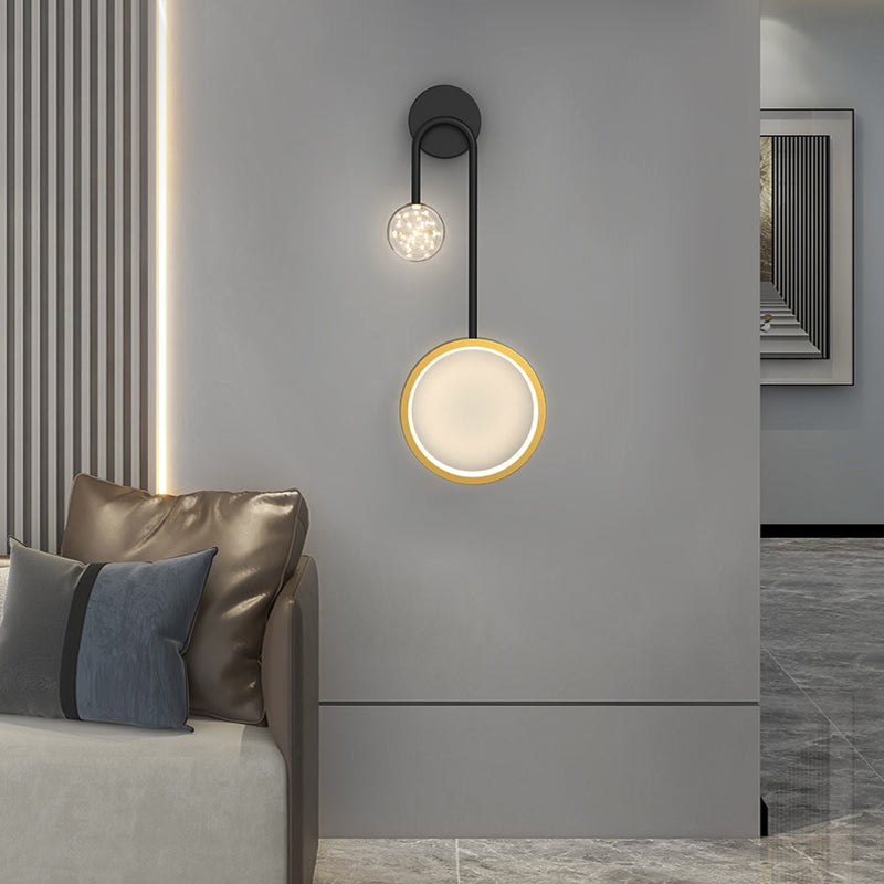 Wall pendant light providing soft light in a stylish living room with a white sofa.