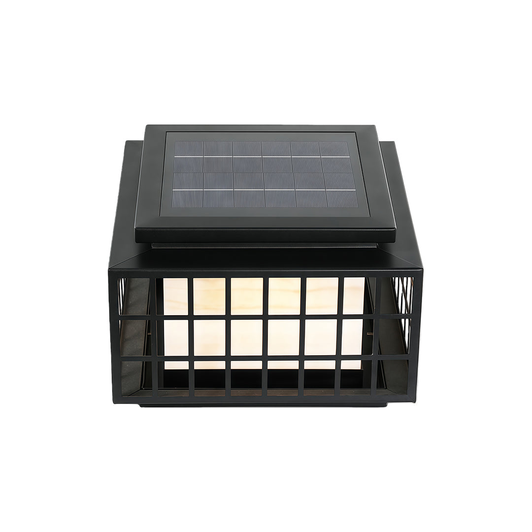 Modern gate pillar lights with a black metal grid, providing warm illumination for outdoor spaces.