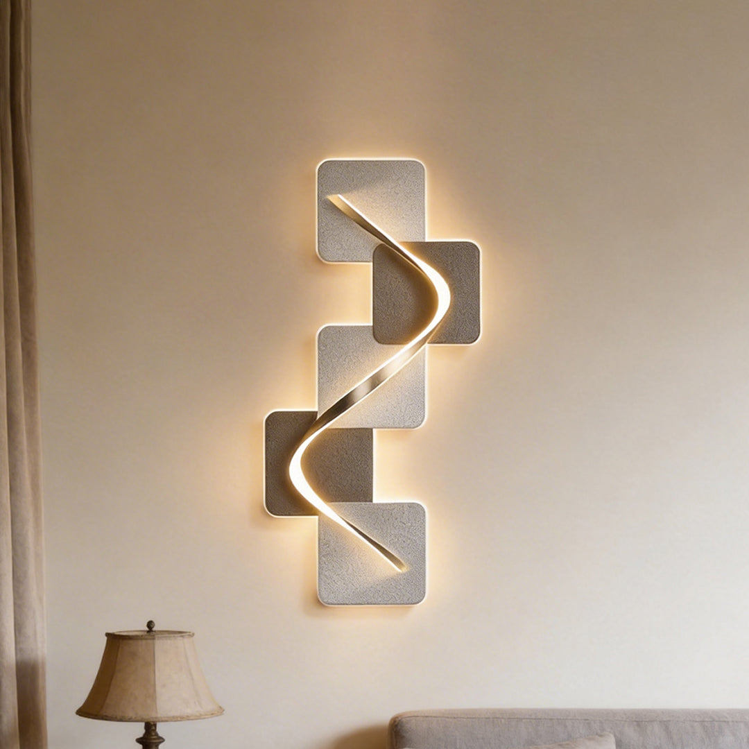 Warm wave pattern wall sconce glowing softly above a cozy sofa in a modern living room setting.