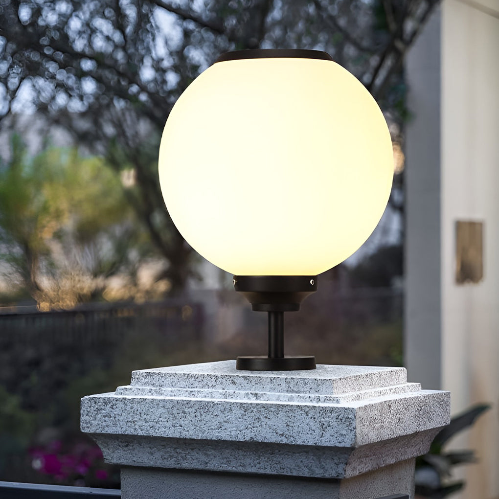 Waterproof outdoor gate pillar light with a spherical design, showcasing water droplets for durability in rainy weather.