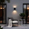 Waterproof outdoor porch lights illuminating a cozy patio seating area with warm glow.