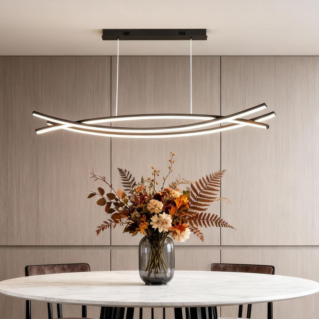 Wave hanging light centered above a round dining table
