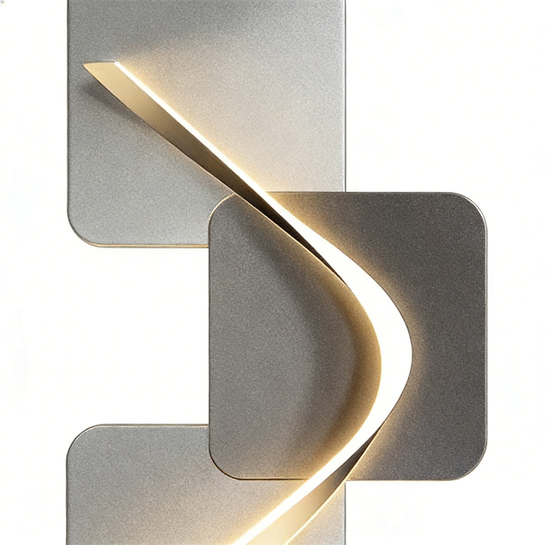Wave pattern wall sconce with a close-up of its illuminated wave pattern.