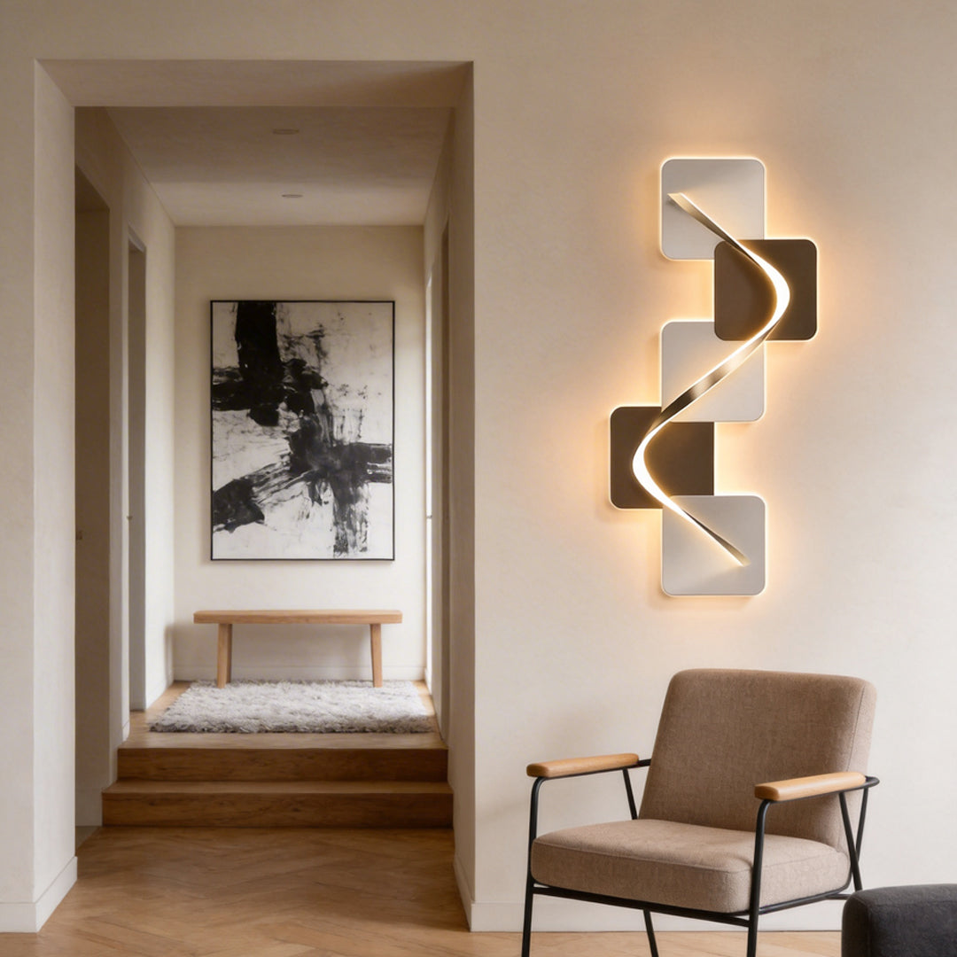 Wave pattern wall sconce with a sleek design, illuminating a modern hallway.