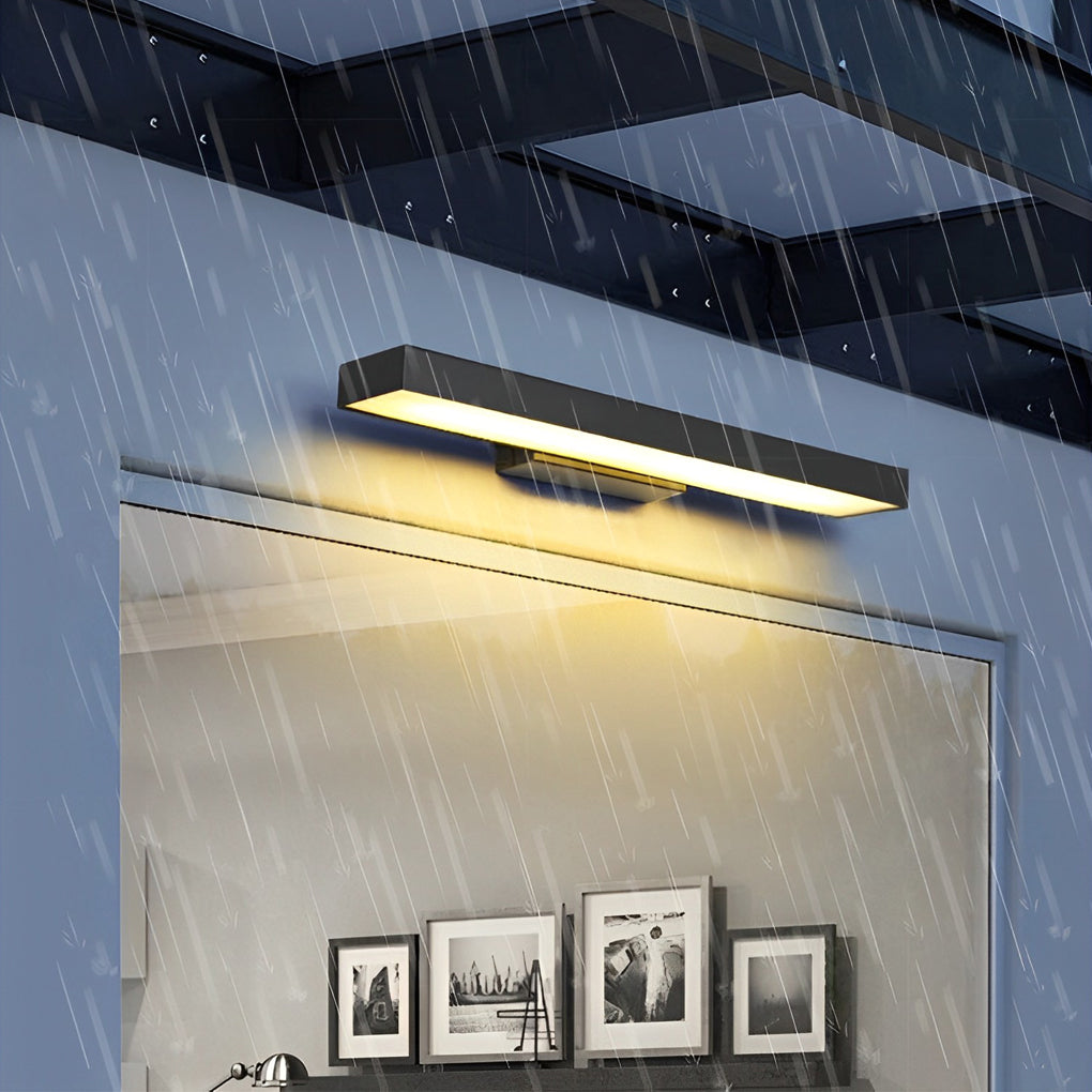 Weather-resistant LED linear wall light installed outdoors in rainy conditions, demonstrating durable design and consistent illumination.