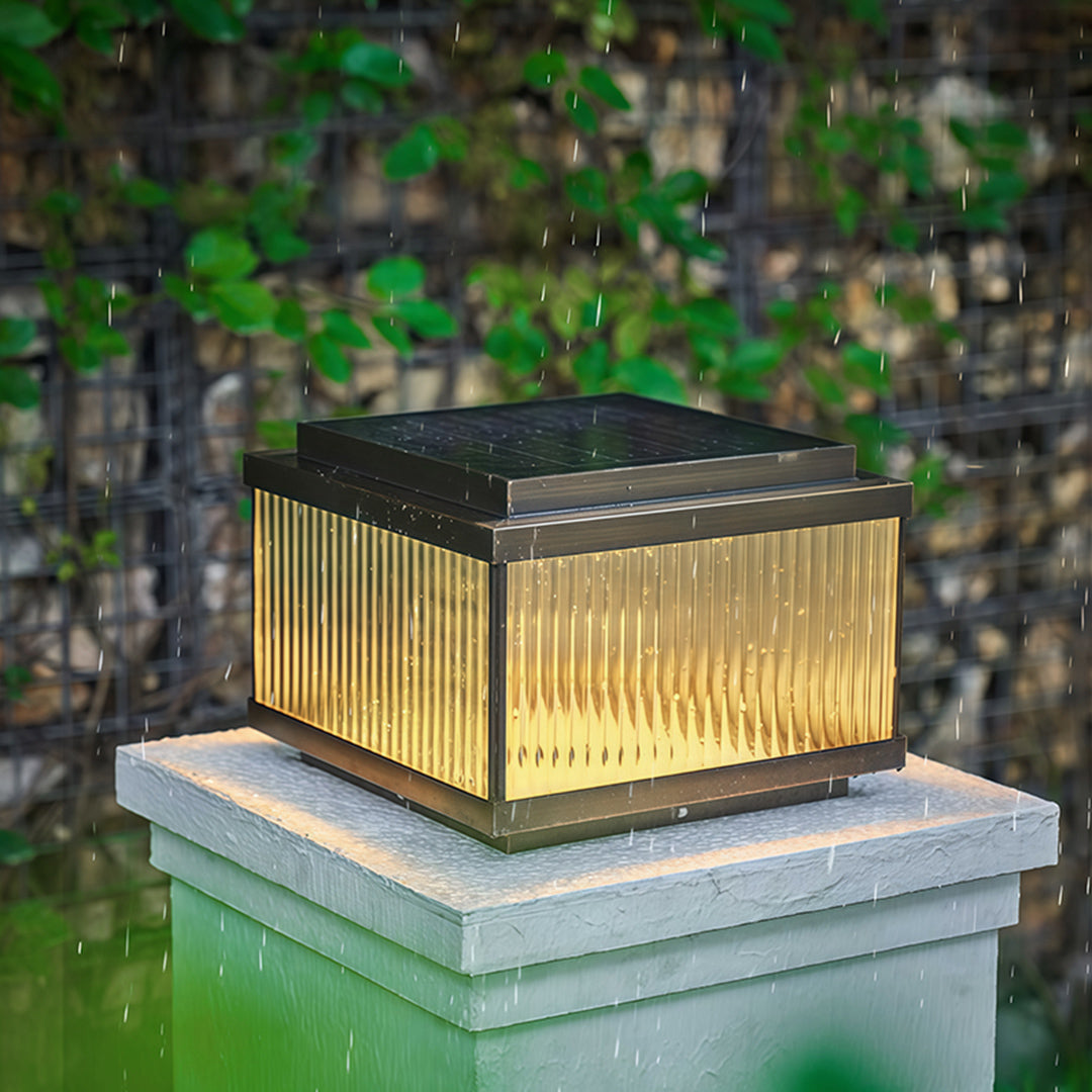 Close-up white copper pillar light displaying vertical slat design and architectural detailing.